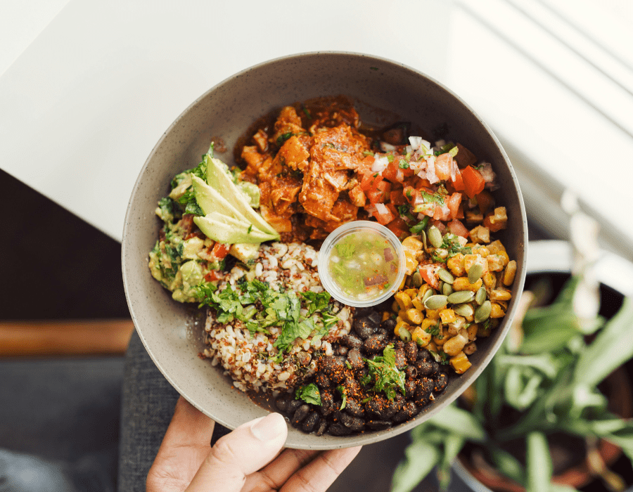 Easy quinoa recipe with vegetables and herbs in a bowl