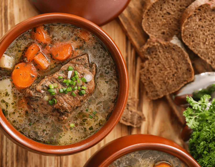Warm and hearty vegetable soup made in a crockpot, perfect for healthy eating and meal prep.